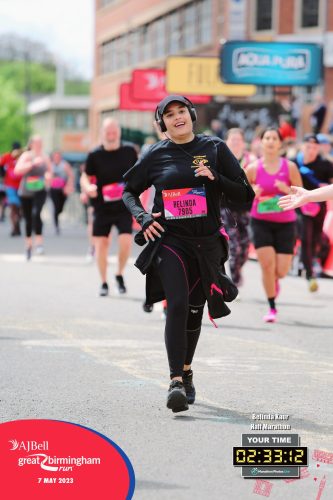Belinda Kaur runs towards the finish line. This official photo for the Great Birmingham Run shows her finish time of 2 hours, 33 mins and 12 seconds