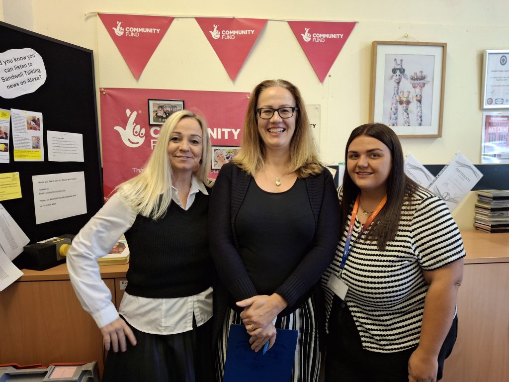 Kelly, Susan and Leah in the SVI foyer with Big Lotter Community Fund bunting in the background